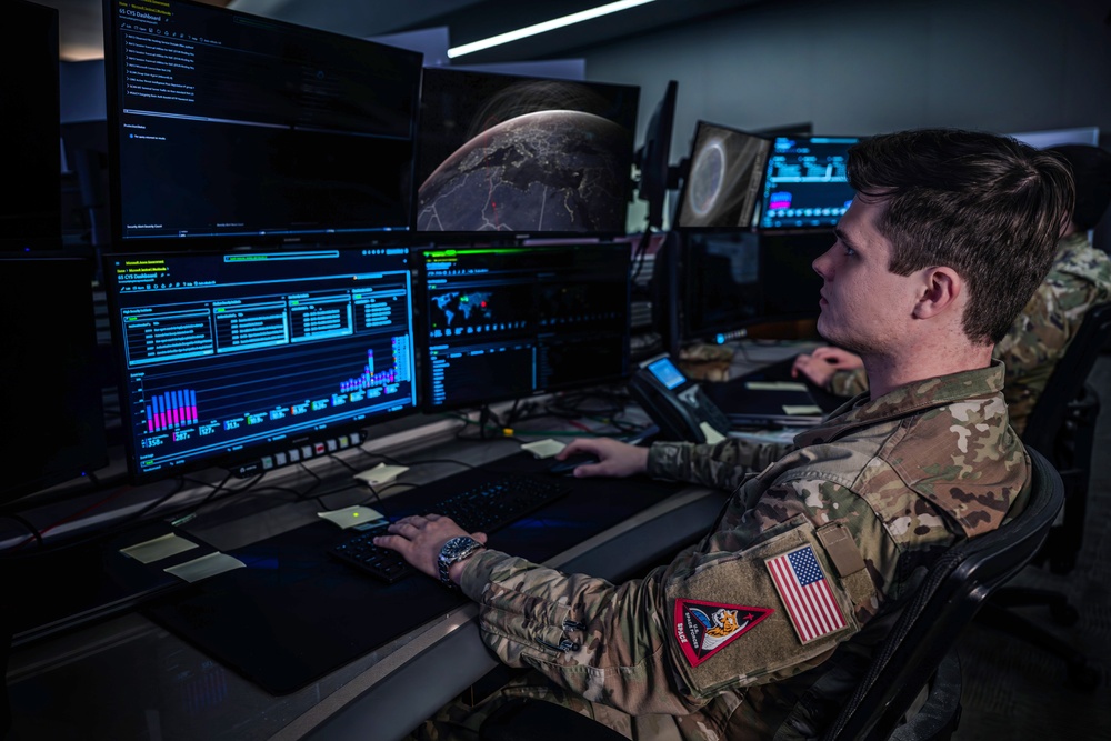 Combined Space Operations Center (CSpOC) staff monitor workstations.