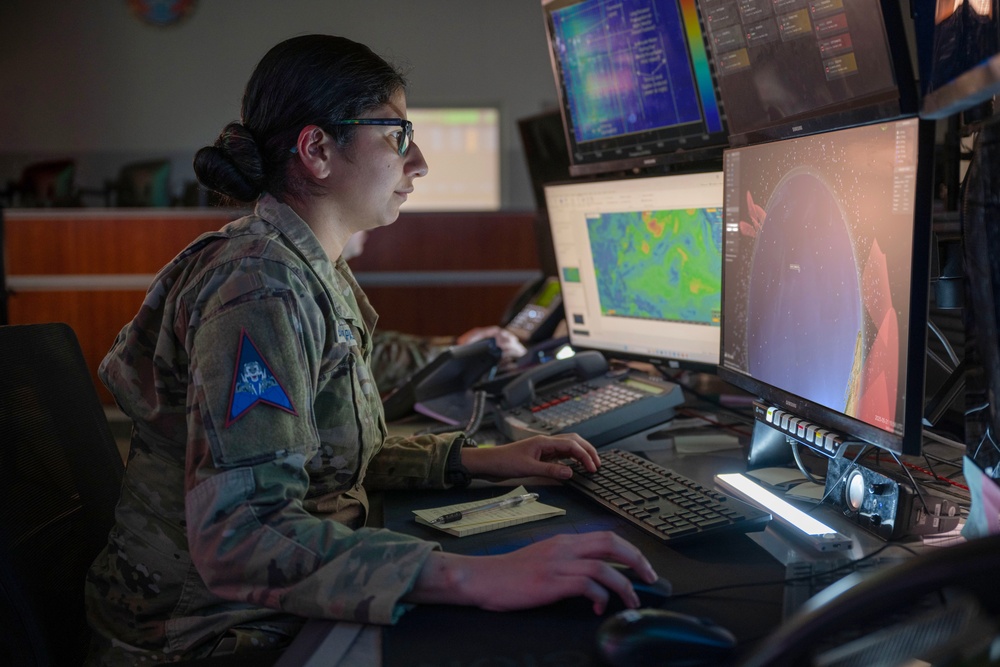 Combined Space Operations Center (CSpOC) staff monitor workstations.