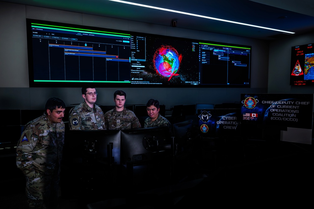 Combined Space Operations Center (CSpOC) staff monitor workstations.