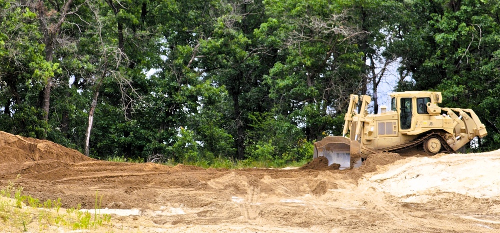 Engineer battalion Soldiers work on earth-moving troop project at Fort McCoy during July 2025 training