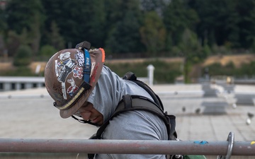Shipboard Contractors Perform Maintenance