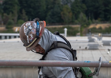 Shipboard Contractors Perform Maintenance