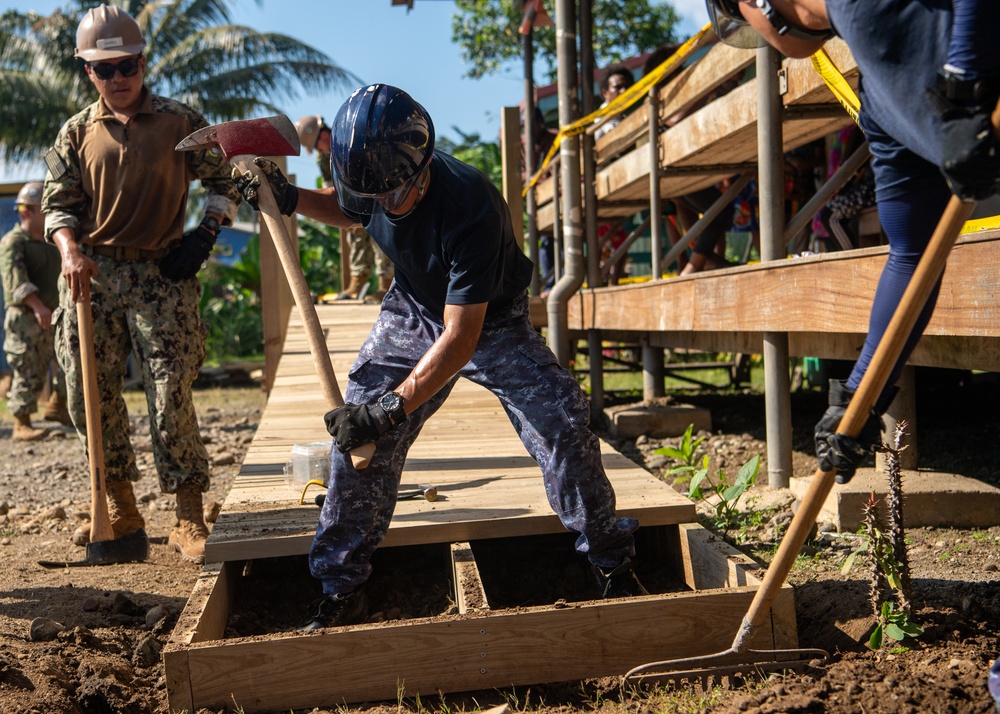 Pacific Partnership 2025 multinational service members construct a ramp in Lae, Papua New Guinea, August 2025