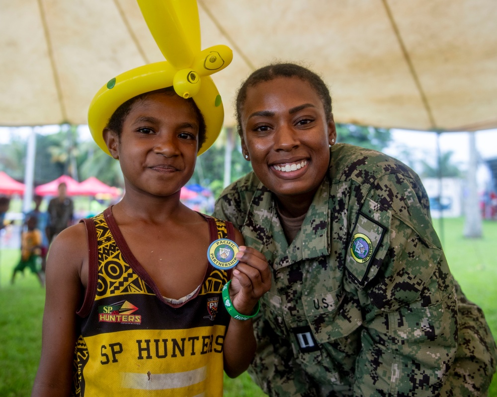 Pacific Partnership 2025 Multinational Servicemembers Play Games with local children in Lae, Papua New Guinea, August 2025