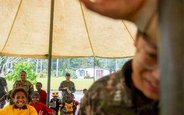 Pacific Partnership 2025 Multinational Servicemembers Play Games with local children in Lae, Papua New Guinea, August 2025