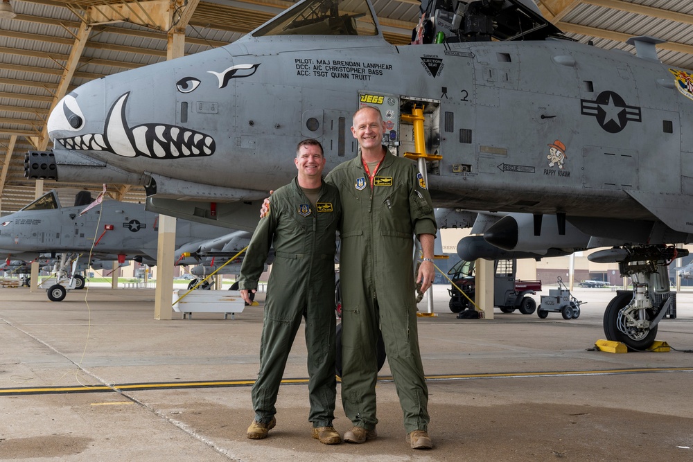 Col. Brian Leiter and Col. Rick Mitchell stand beside an A-10 Thunderbolt II