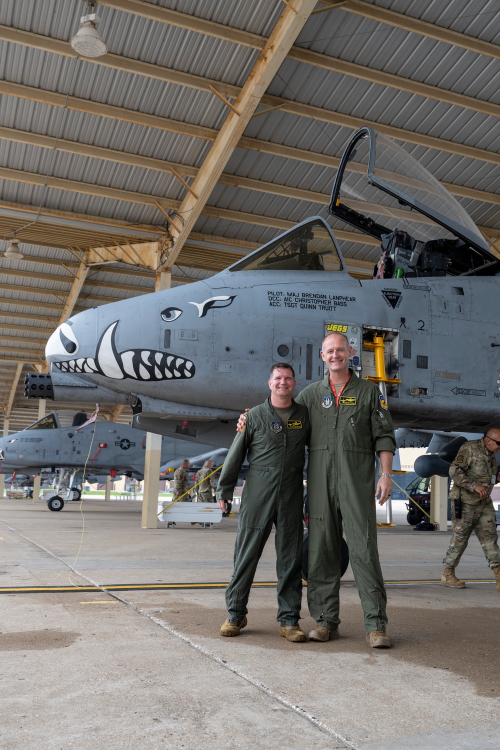 Col. Brian Leiter and Col. Rick Mitchell stand beside an A-10 Thunderbolt II