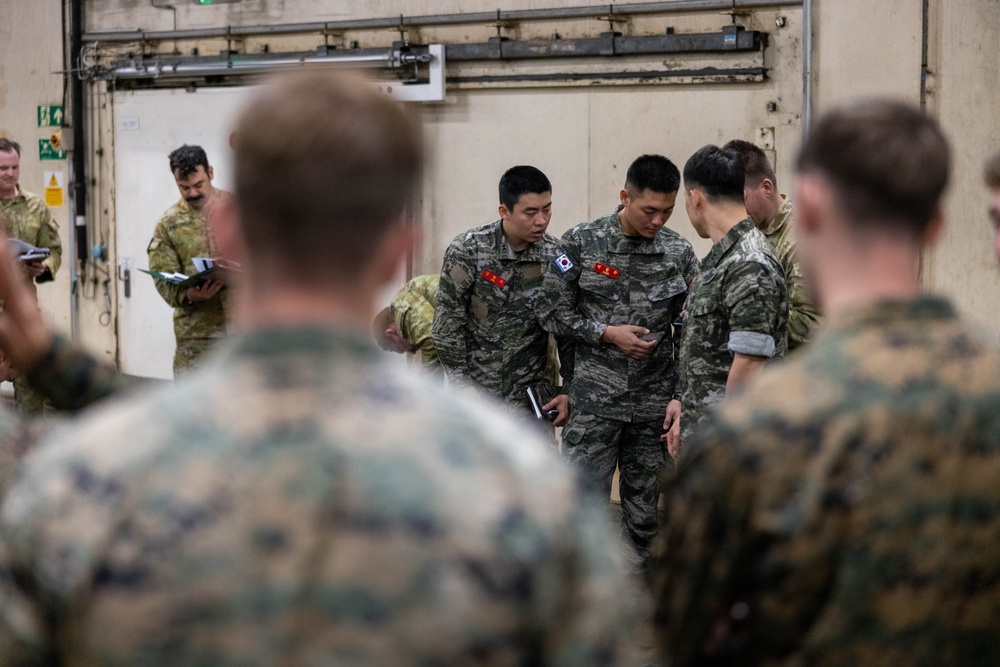 U.S. Marines with 1st Recon Bn., partner forces attend operations order brief