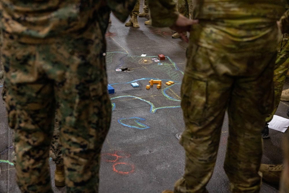 U.S. Marines with 1st Recon Bn., partner forces attend operations order brief