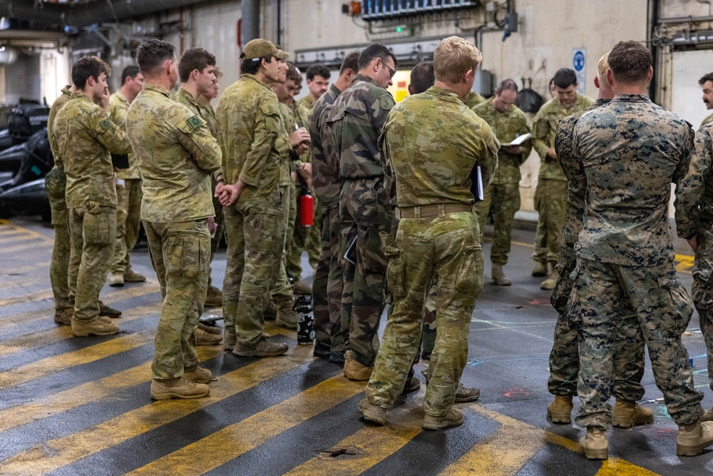U.S. Marines with 1st Recon Bn., partner forces attend operations order brief