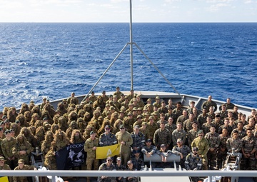 U.S. Marines with 1st Recon Bn., partner forces pose for group photograph aboard HMAS Choules