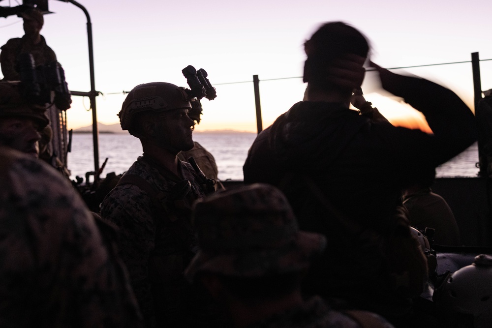 U.S. Marines with 1st Recon Bn., Australian Army soldiers prepare for nighttime small boat insertion