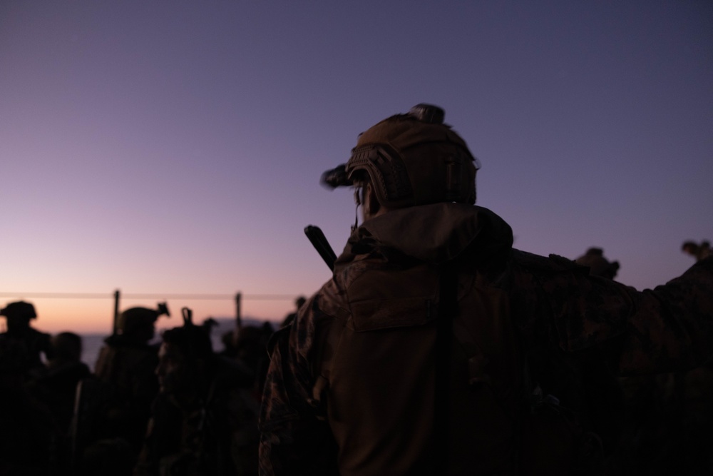 U.S. Marines with 1st Recon Bn., Australian Army soldiers prepare for nighttime small boat insertion