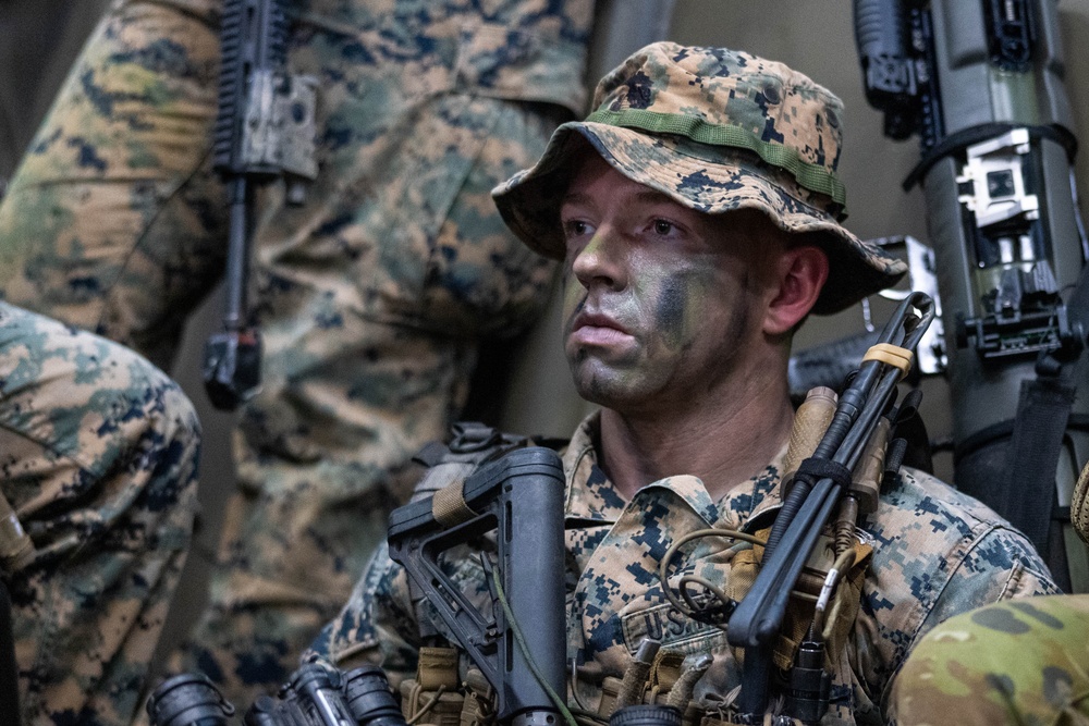 U.S. Marines with 1st Recon Bn., Australian Army soldiers prepare for nighttime small boat insertion