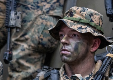 U.S. Marines with 1st Recon Bn., Australian Army soldiers prepare for nighttime small boat insertion