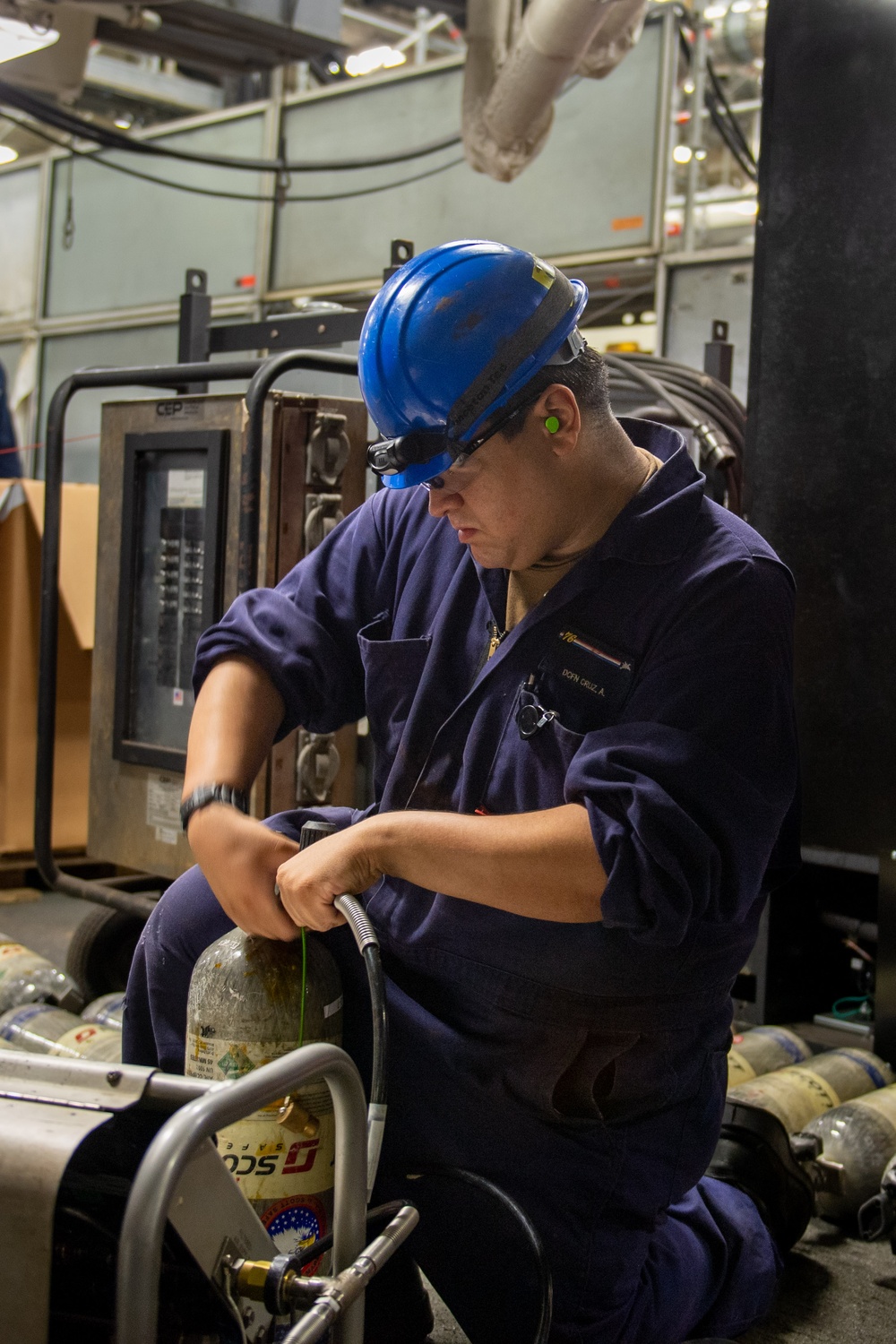 Reagan Sailors refill SCBA