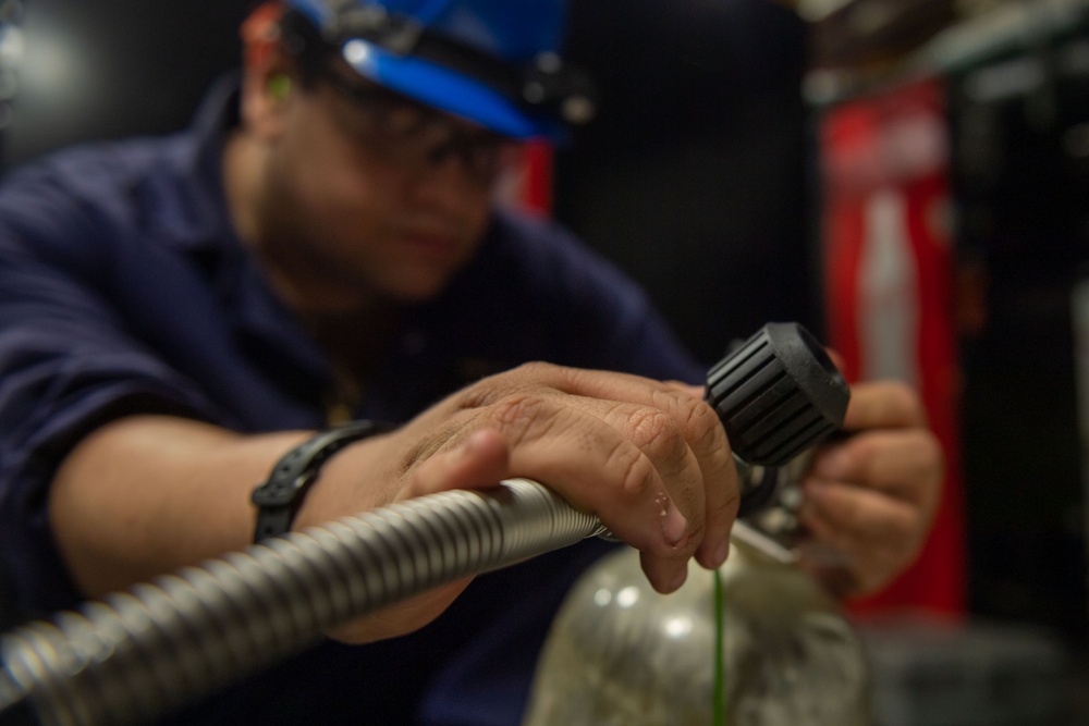 Reagan Sailors refill SCBA