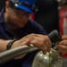 Reagan Sailors refill SCBA