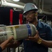 Reagan Sailors refill SCBA