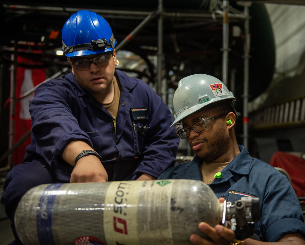 Reagan Sailors refill SCBA