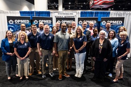 Operational Medical Systems team wraps exhibit during medical symposium day three