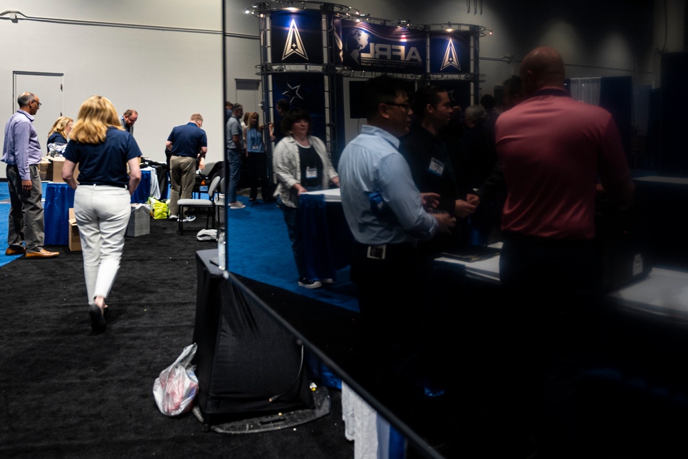 Operational Medical Systems team wraps exhibit during medical symposium day three