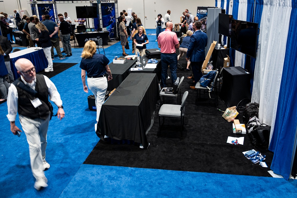 Operational Medical Systems team wraps exhibit during medical symposium day three