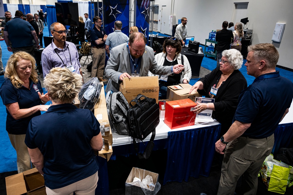 Operational Medical Systems team wraps exhibit during medical symposium day three