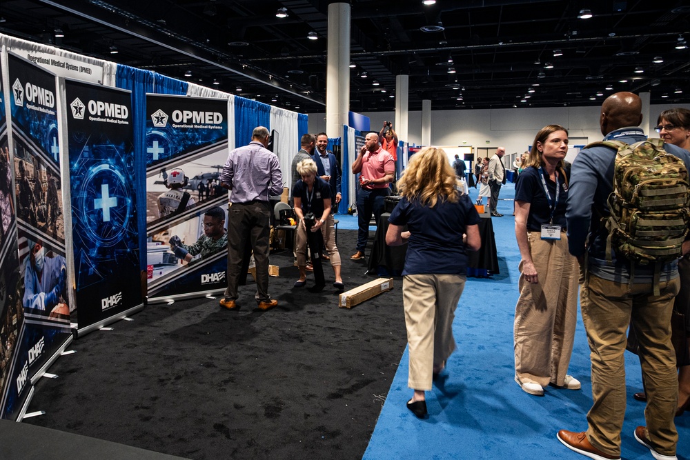 Operational Medical Systems team wraps exhibit during medical symposium day three
