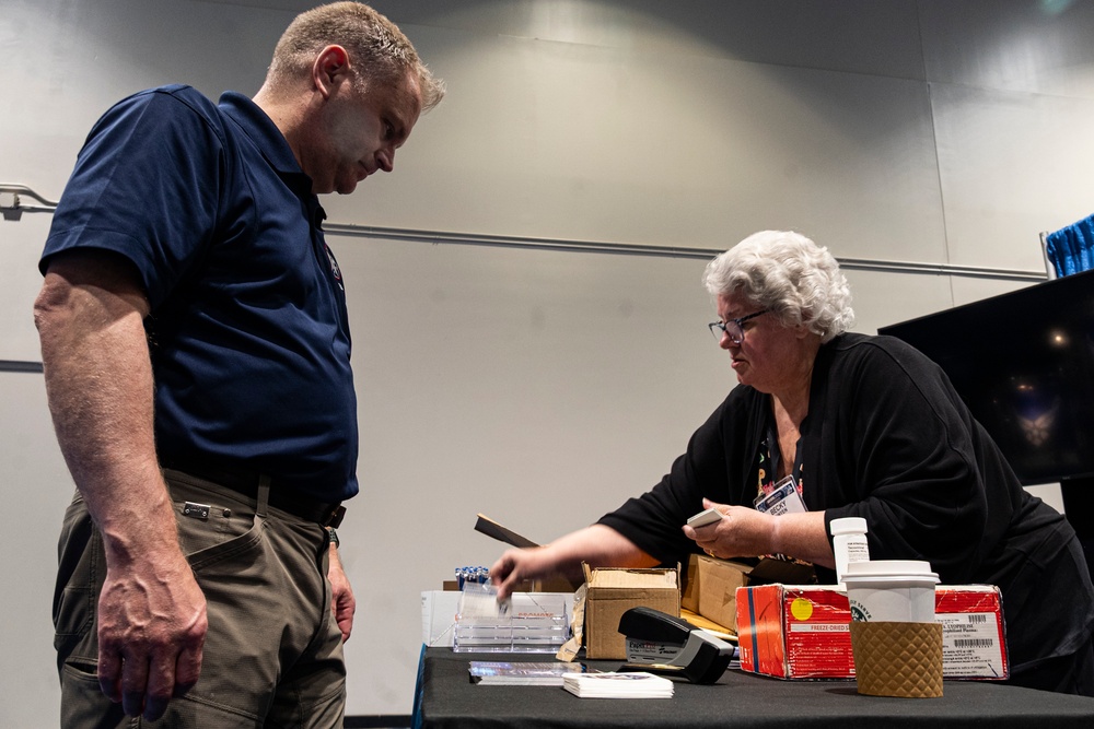 Operational Medical Systems team wraps exhibit during medical symposium day three