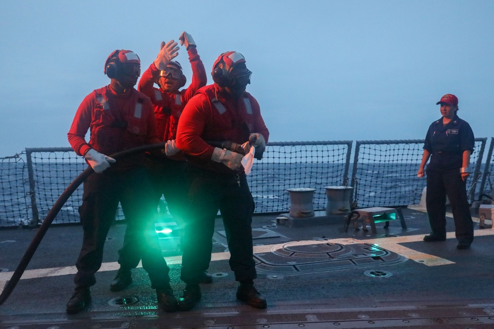 Sailors aboard the USS John Finn conduct a crash and salvage drill in the Indian Ocean