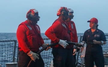 Sailors aboard the USS John Finn conduct a crash and salvage drill in the Indian Ocean