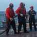 Sailors aboard the USS John Finn conduct a crash and salvage drill in the Indian Ocean