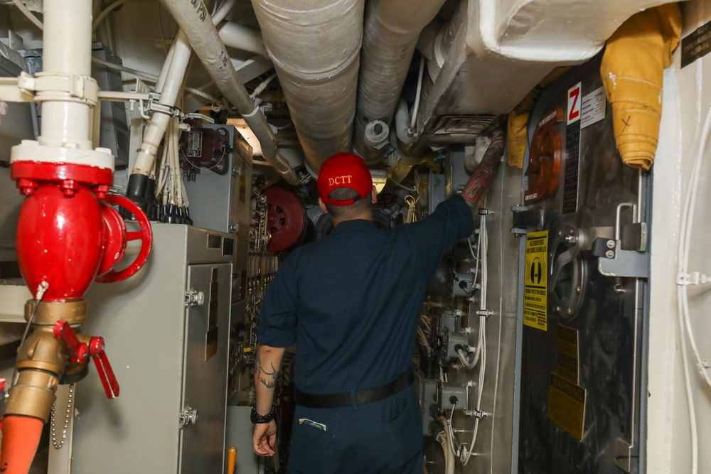 Sailors aboard the USS John Finn conduct a general quarters drill in the Andaman Sea