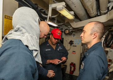 Sailors aboard the USS John Finn conduct a general quarters drill in the Andaman Sea