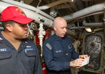 Sailors aboard the USS John Finn conduct a general quarters drill in the Andaman Sea