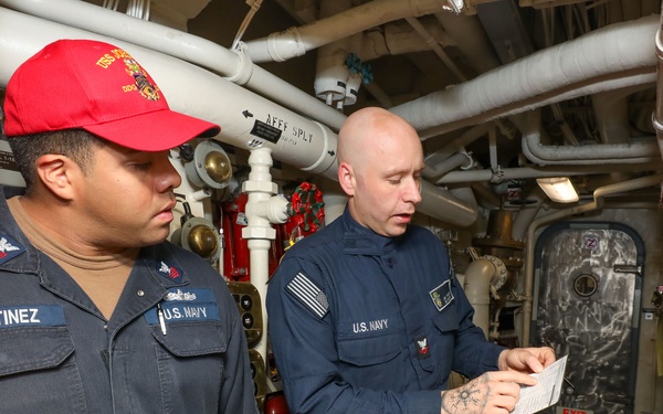 Sailors aboard the USS John Finn conduct a general quarters drill in the Andaman Sea