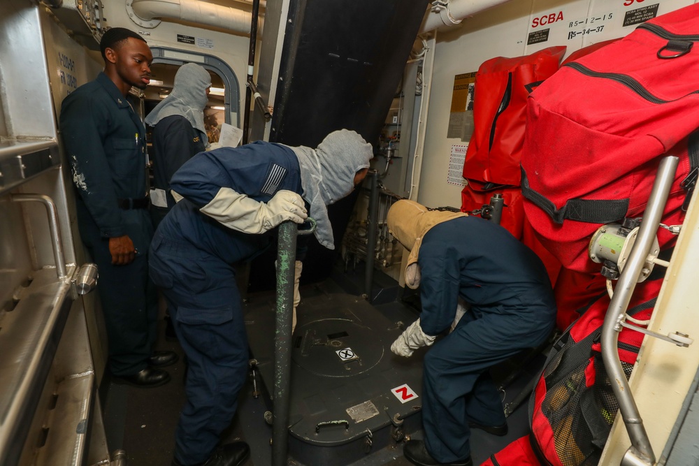 Sailors aboard the USS John Finn conduct a general quarters drill in the Andaman Sea