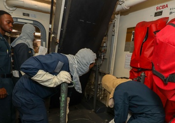 Sailors aboard the USS John Finn conduct a general quarters drill in the Andaman Sea