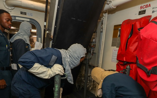 Sailors aboard the USS John Finn conduct a general quarters drill in the Andaman Sea