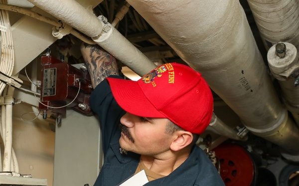 Sailors aboard the USS John Finn conduct a general quarters drill in the Andaman Sea