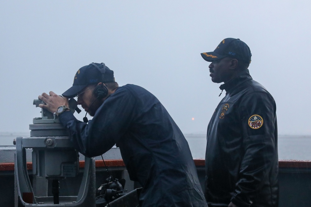 Sailors aboard the USS John Finn conduct a sea and anchor detail in Sembawang, Singapore