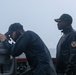Sailors aboard the USS John Finn conduct a sea and anchor detail in Sembawang, Singapore