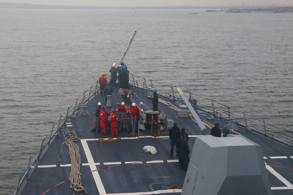 Sailors aboard the USS John Finn conduct a sea and anchor detail in Sembawang, Singapore
