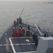 Sailors aboard the USS John Finn conduct a sea and anchor detail in Sembawang, Singapore