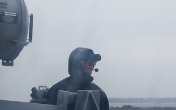Sailors aboard the USS John Finn conduct a sea and anchor detail in Sembawang, Singapore