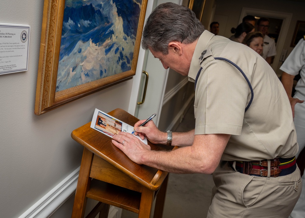 UK Royal Navy 1SL Gen. Sir Gwyn Jenkins Signs the Guestbook During Counterpart Engagement