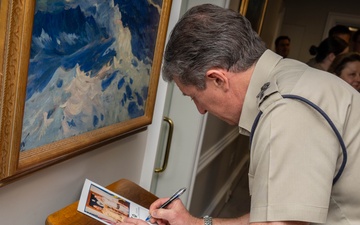 UK Royal Navy 1SL Gen. Sir Gwyn Jenkins Signs the Guestbook During Counterpart Engagement