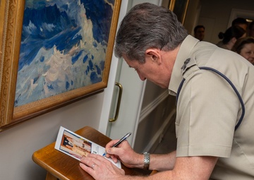 UK Royal Navy 1SL Gen. Sir Gwyn Jenkins Signs the Guestbook During Counterpart Engagement