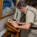 UK Royal Navy 1SL Gen. Sir Gwyn Jenkins Signs the Guestbook During Counterpart Engagement